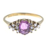 A 9ct gold ruby and diamond dress ring.Estimated total diamond weight 0.10ct.Hallmarks for London,