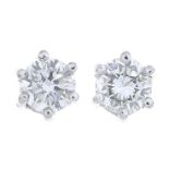 A pair of brilliant-cut diamond stud earrings.Total diamond weight 0.40ct,