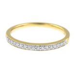 A diamond half eternity ring.Total diamond weight 0.13ct, stamped to band.