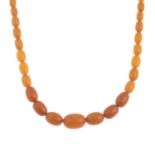 An amber bead necklace.Approximate dimensions of amber beads 20 to 9.5mms.