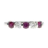 An 18ct gold ruby and diamond half eternity ring.Estimated total diamond weight 0.30ct,