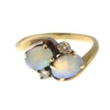 An opal and diamond ring.Estimated total diamond weight 0.10ct.Stamped 14K.Ring size J1/2.