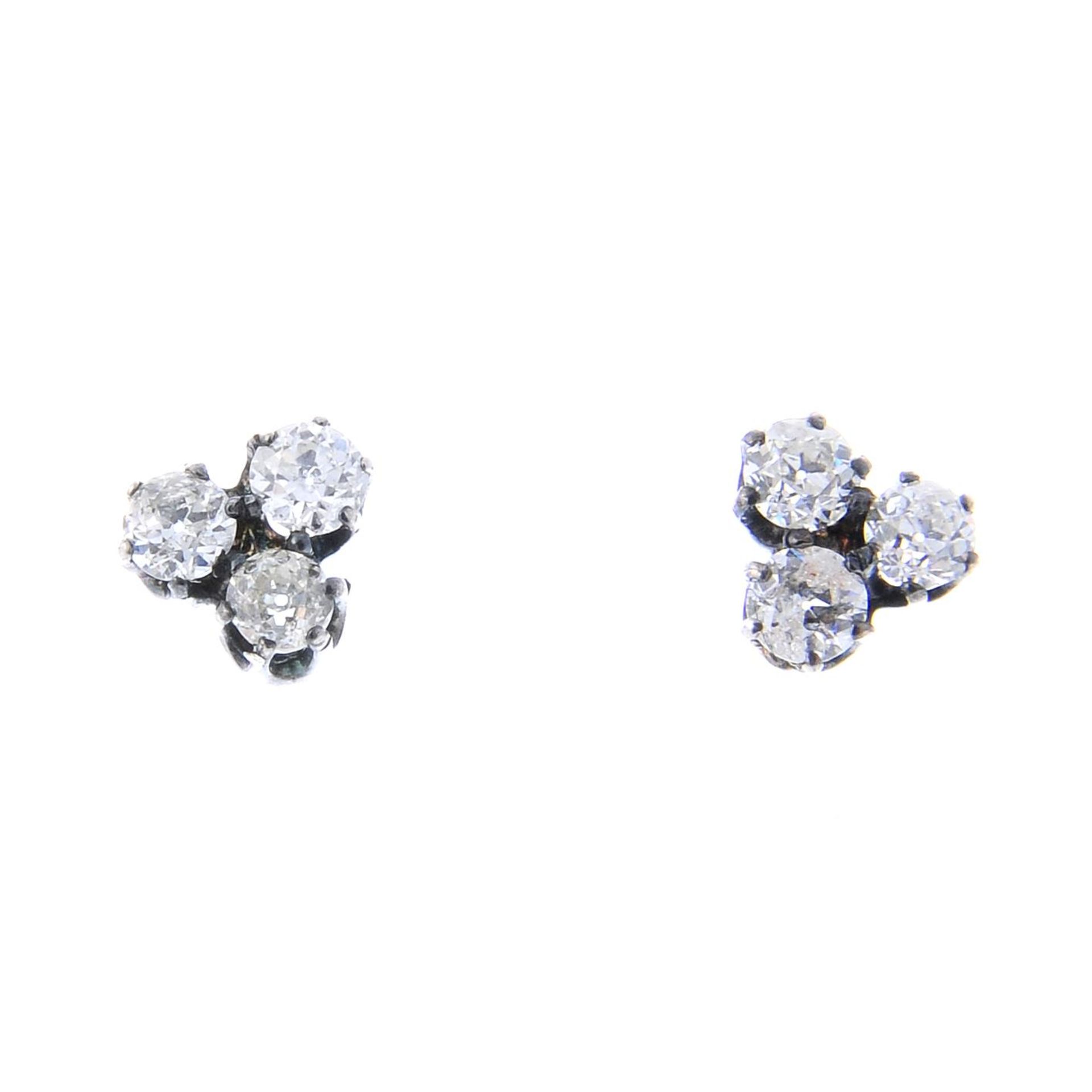 A pair of old-cut diamond trefoil stud earrings.Estimated total diamond weight 1ct,