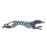 An emerald, ruby, sapphire and diamond greyhound brooch.Length 5cms.