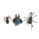 A selection of jewellery to include two spider brooches and a French jet necklace.