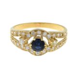 A sapphire, diamond and colourless gem ring.Estimated total diamond weight 0.25ct.Ring size P1/2.
