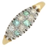 A mid 20th century 18ct gold emerald and vari-cut diamond dress ring.Estimated total diamond weight