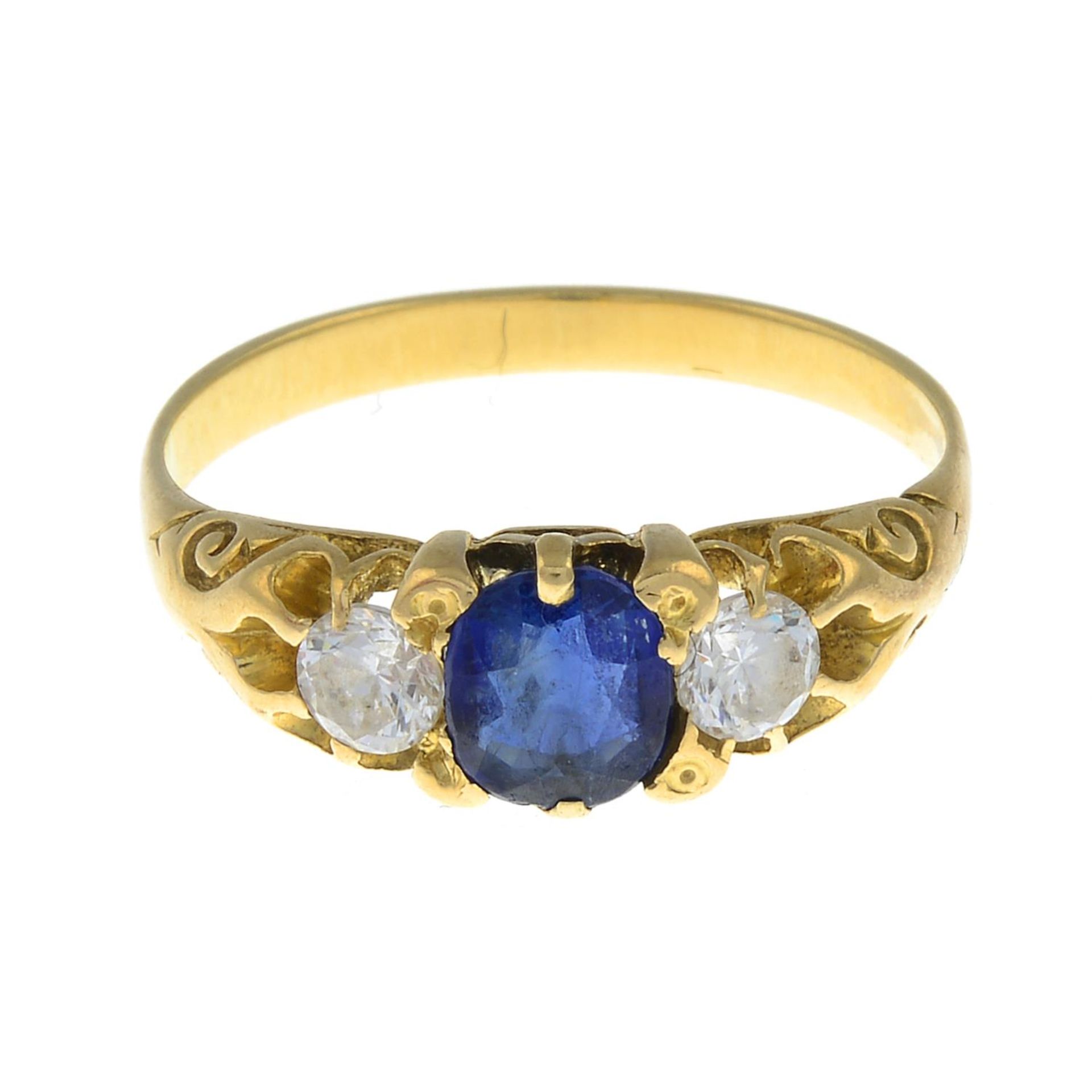 A sapphire and colourless gem three-stone ring.Ring size N.