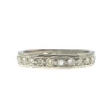 A diamond half eternity ring.Estimated total diamond weight 0.95ct,