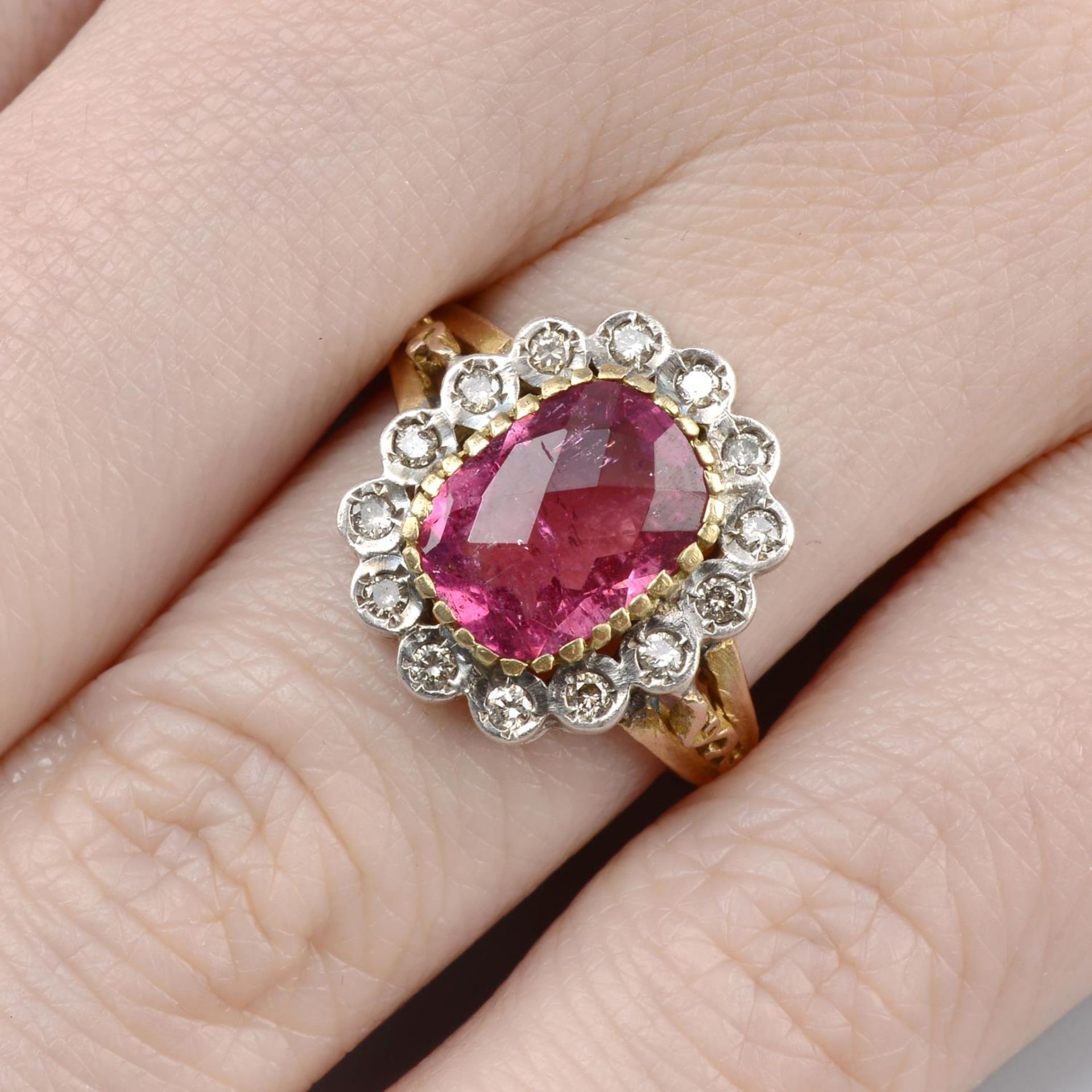 A pink tourmaline and brilliant-cut diamond cluster ring.Tourmaline calculated weight 2.26cts,