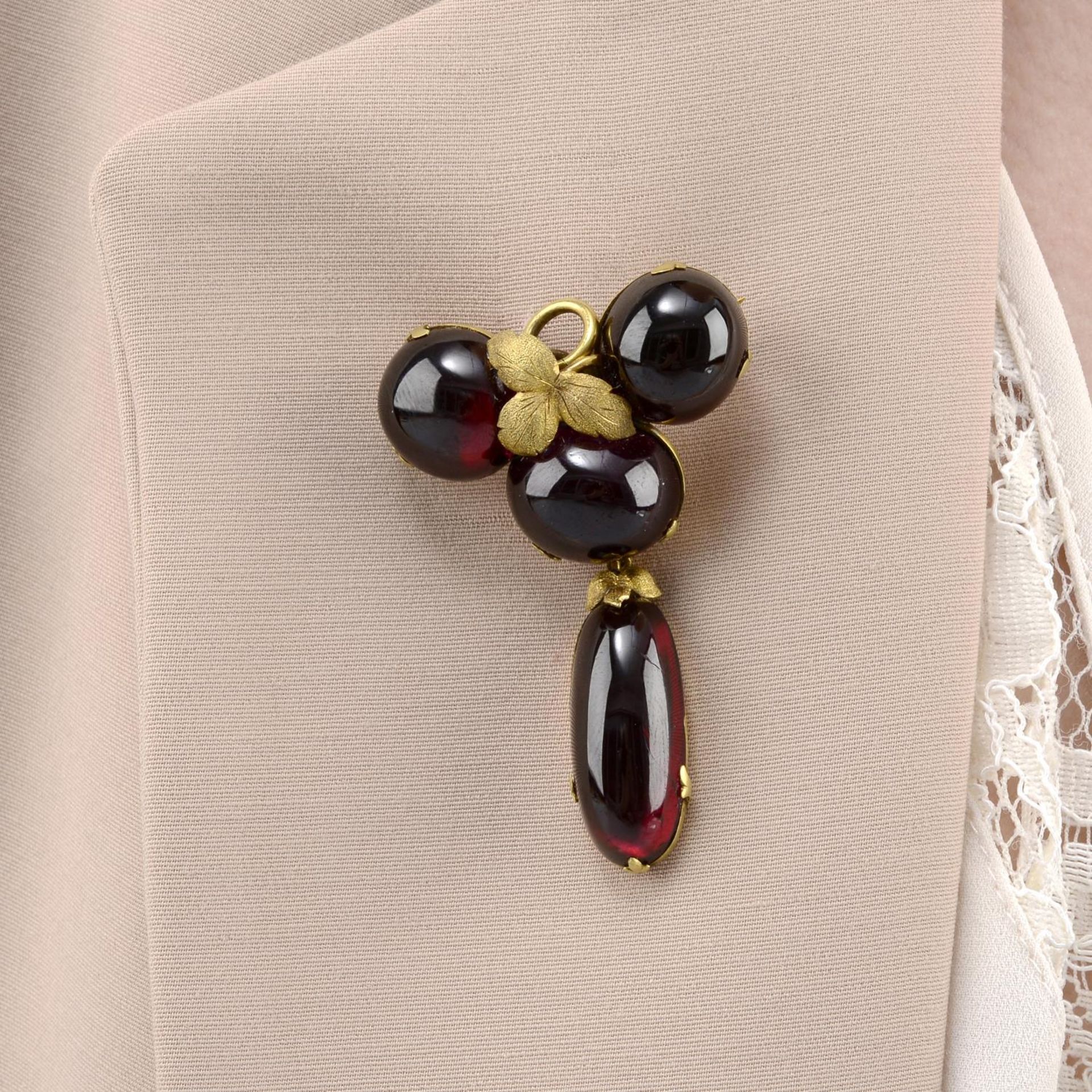 A late 19th century garnet cabochon brooch.May also be worn as a pendant.Length 5.6cms.