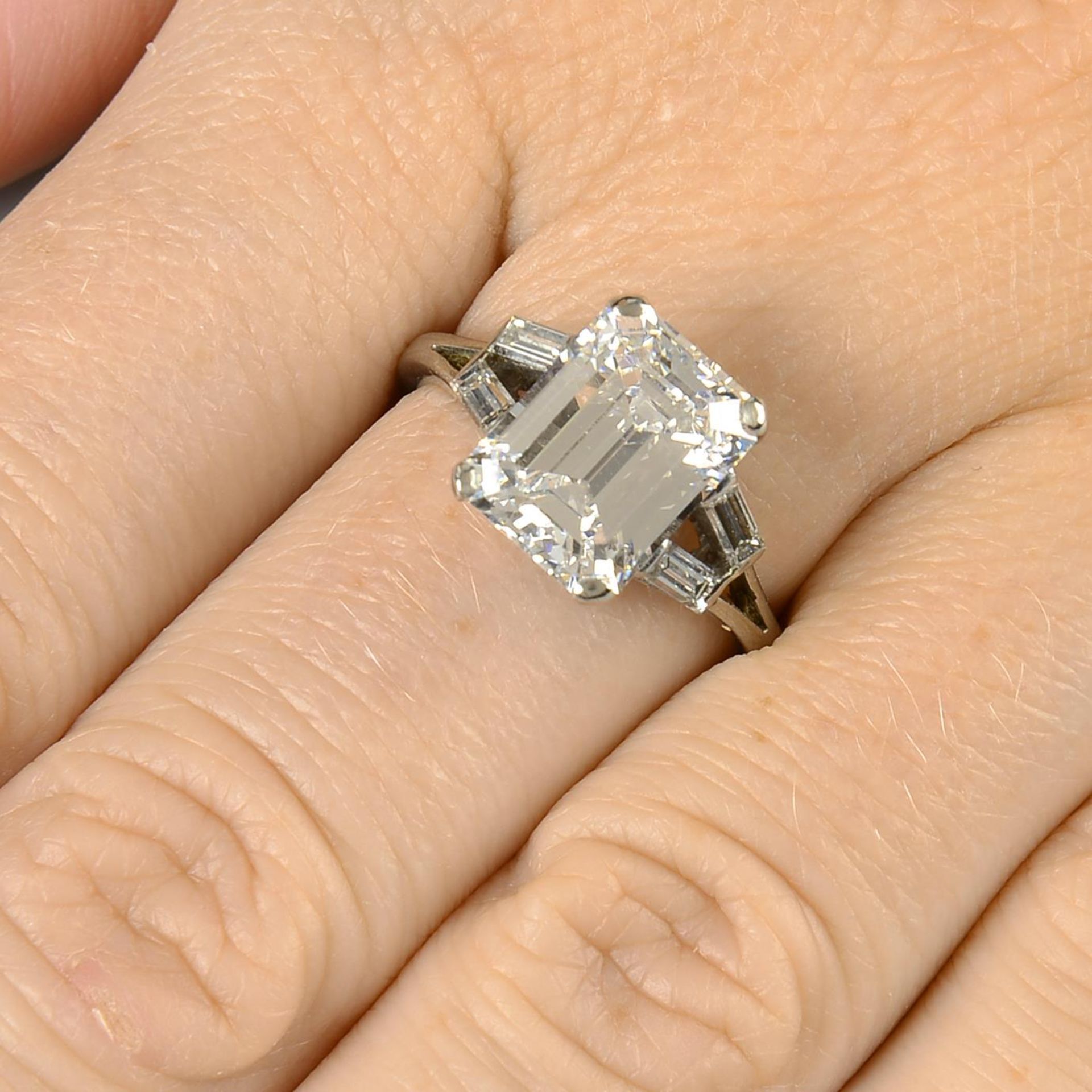 A cut-corner rectangular-shape diamond single-stone ring,