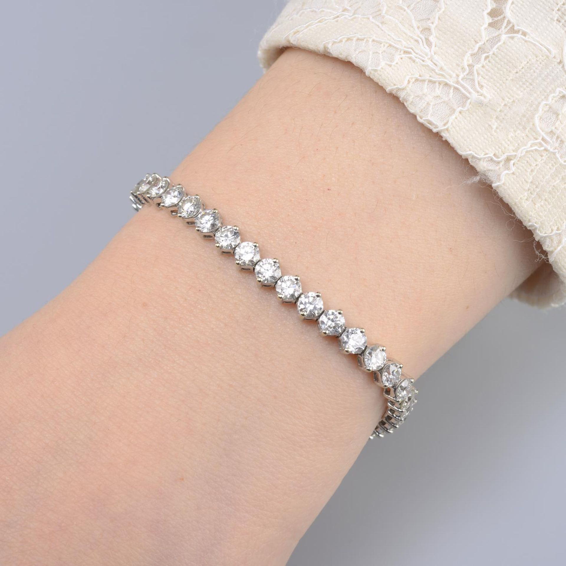 A brilliant-cut diamond line bracelet.