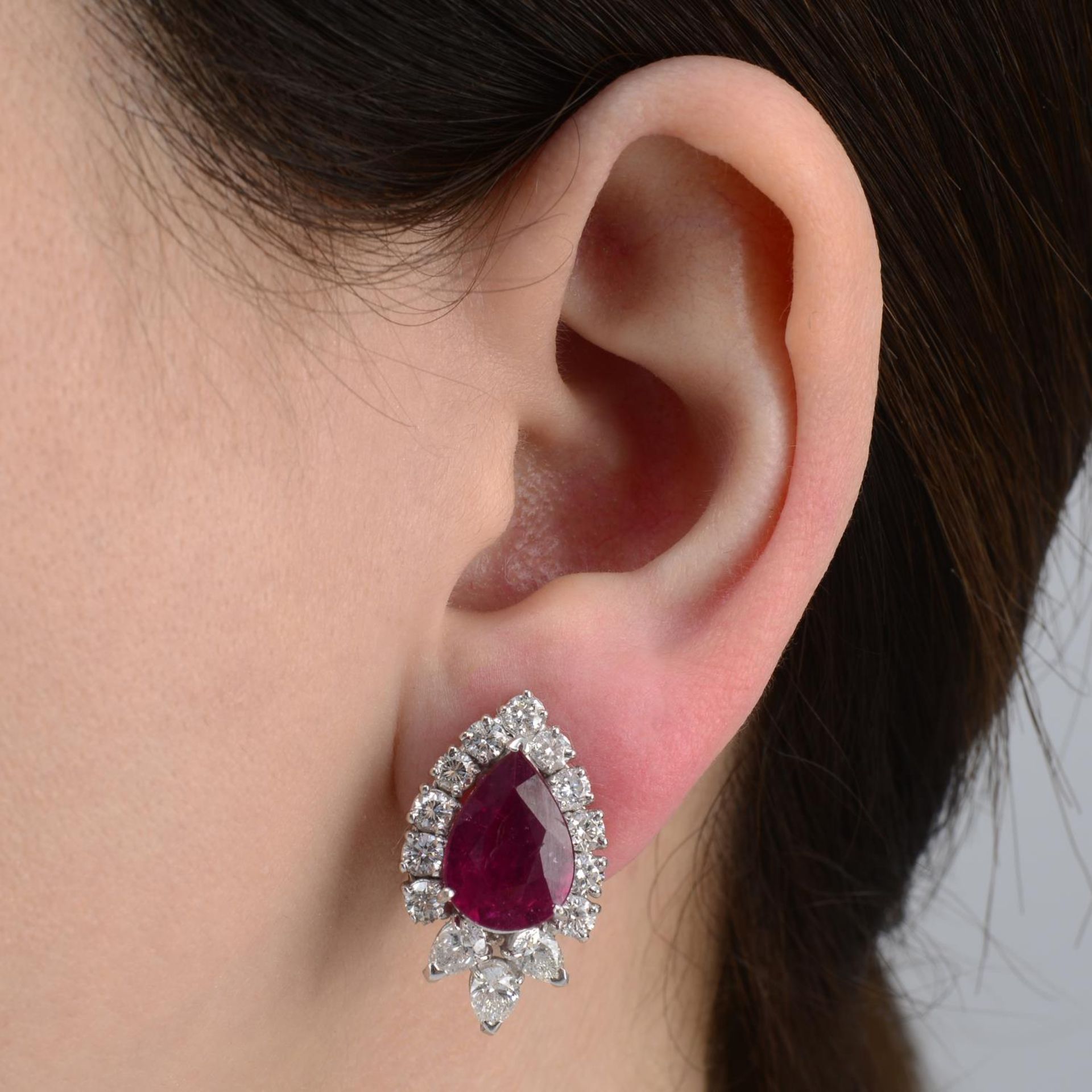 A pair of ruby and vari-cut diamond cluster earrings.