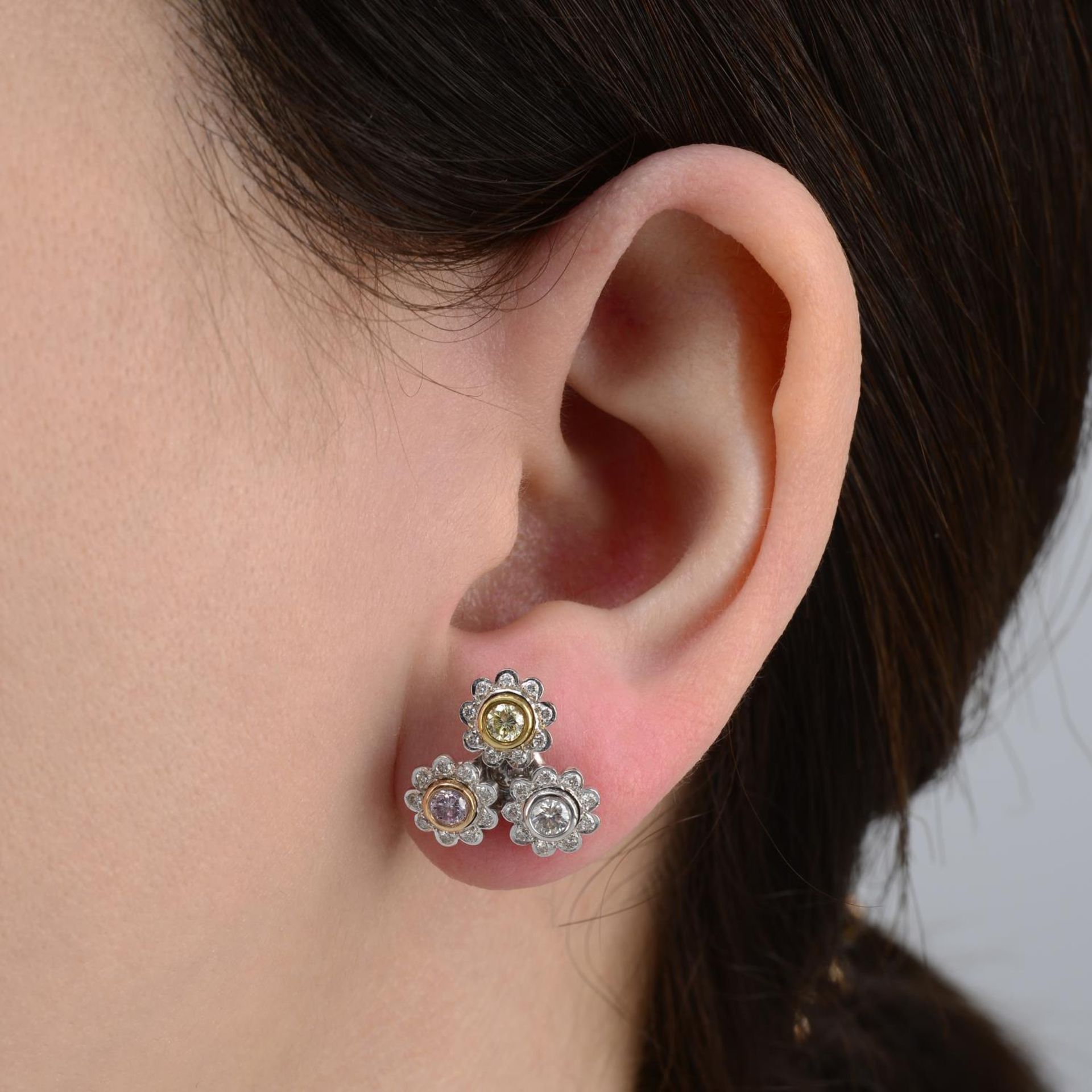 A pair of 18ct gold Natural Fancy Intense Pink and Yellow diamond and diamond floral cluster