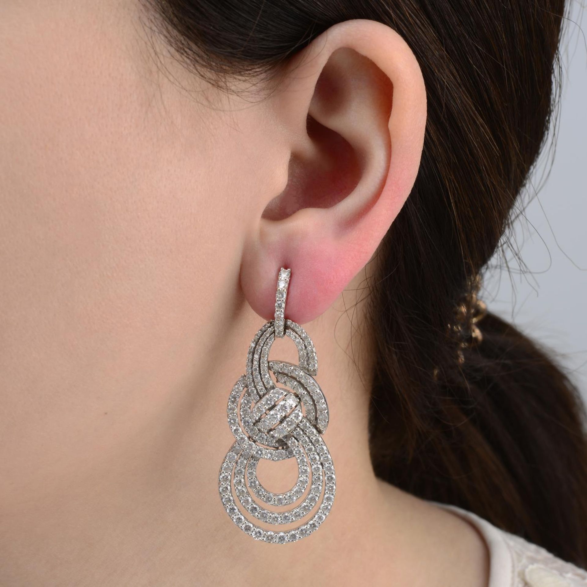 A pair of brilliant-cut diamond drop earrings.Estimated total diamond weight 4cts,