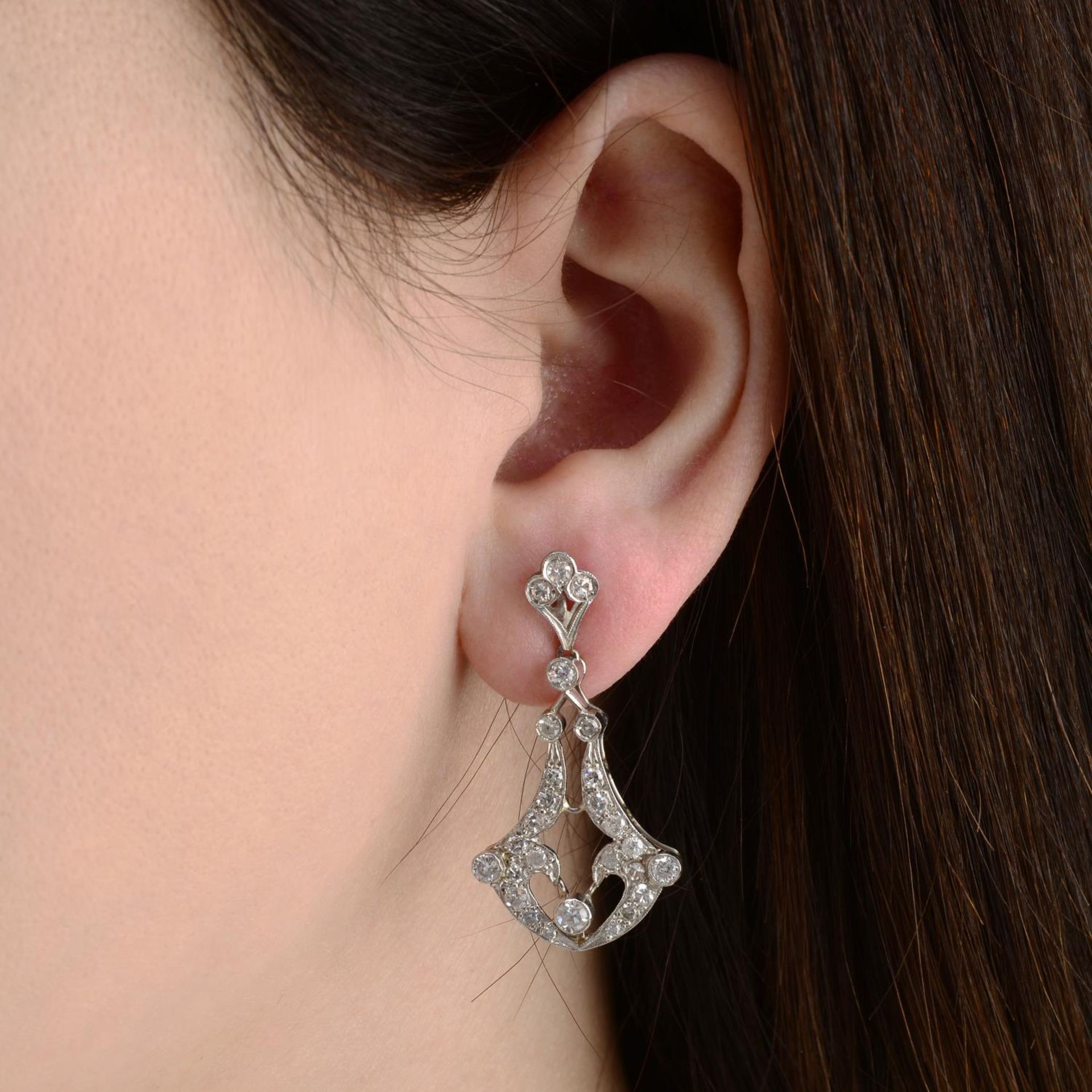 A pair of vari-cut diamond earrings.Estimated total diamond weight 1.20cts,