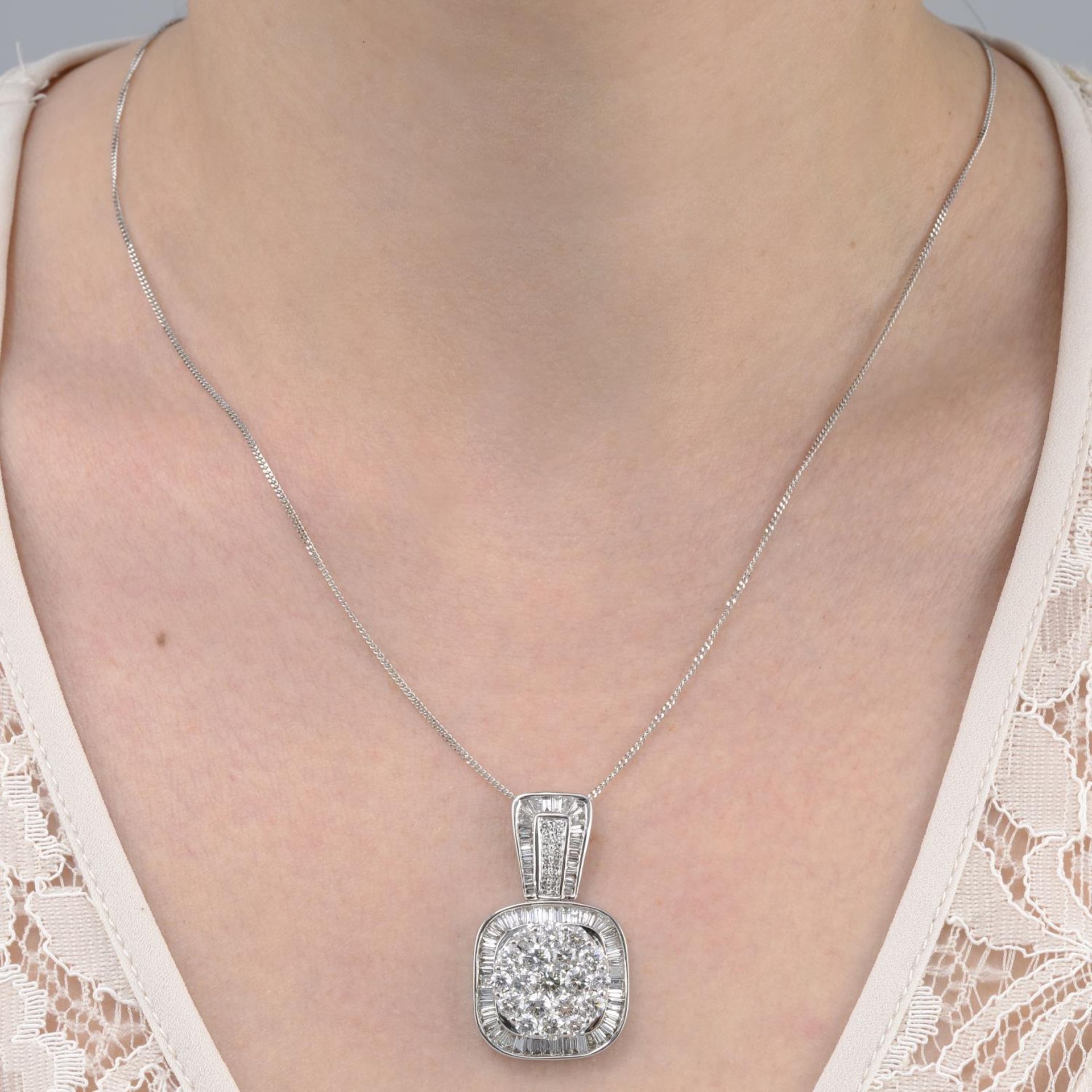 A vari-cut diamond cluster pendant,