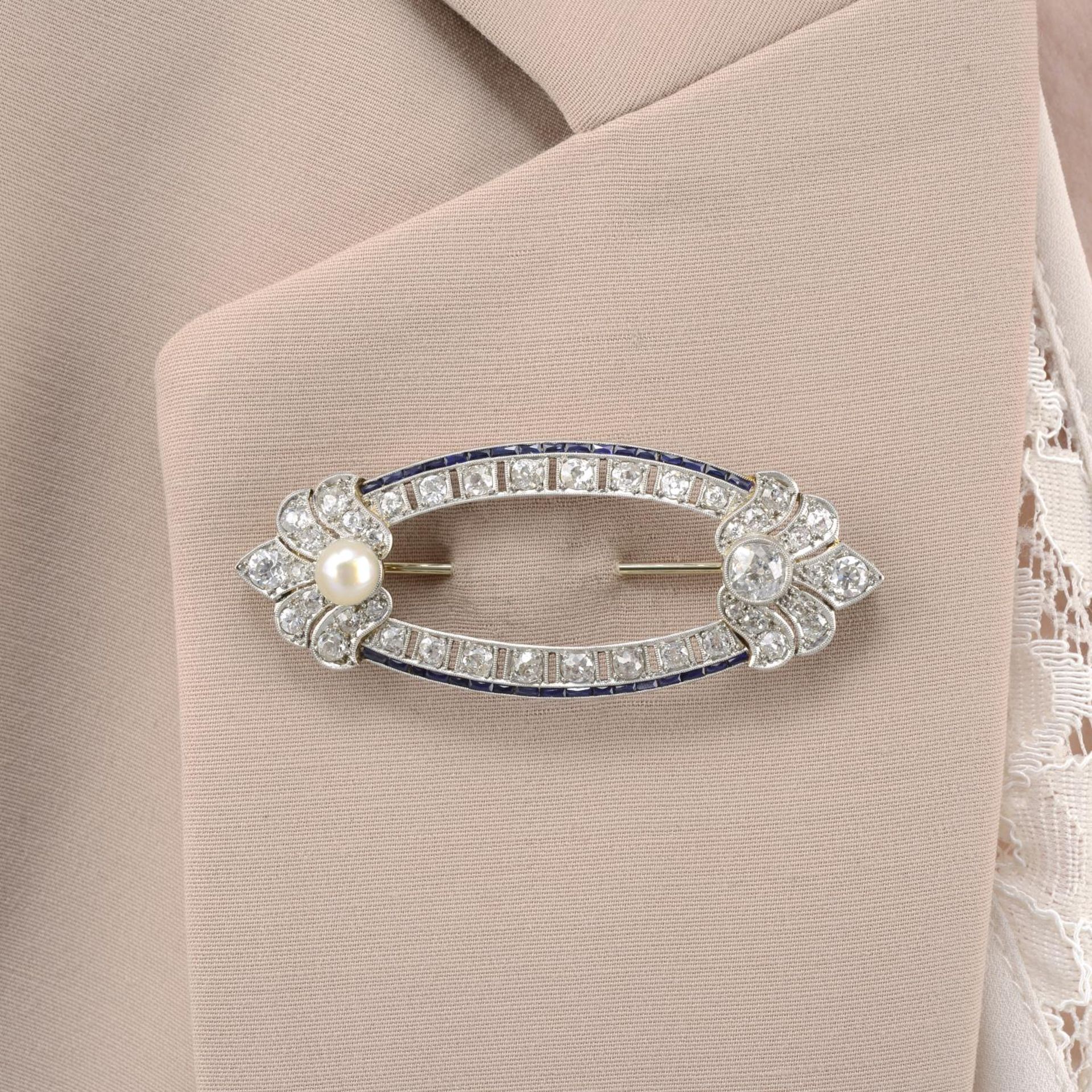 A mid 20th century gold old-cut diamond, pearl and calibre-cut sapphire brooch.