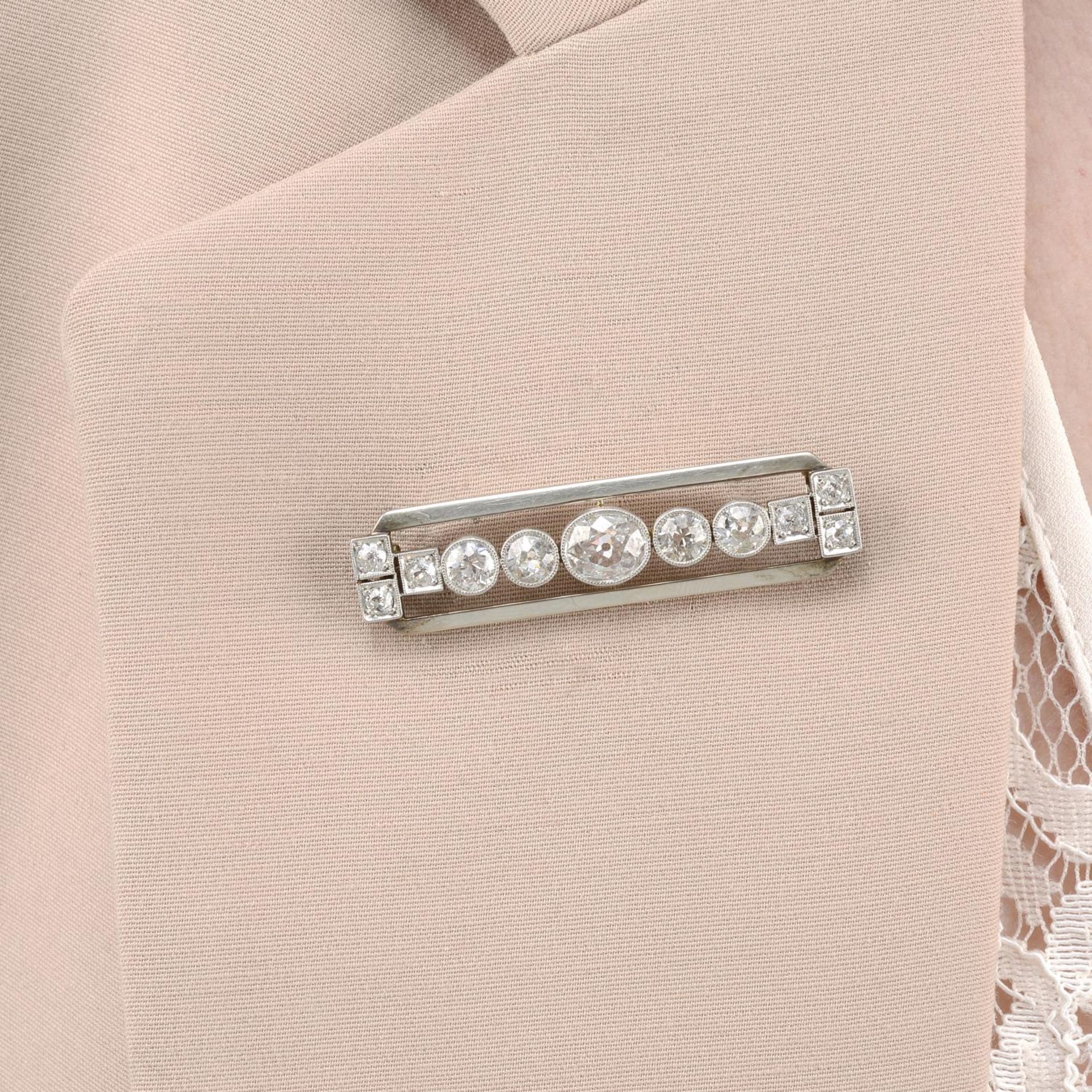 An Art Deco old-cut diamond bar brooch.Estimated total diamond weight 2.75cts,