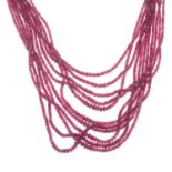 A ruby multi-row necklace, with adjustable cord.