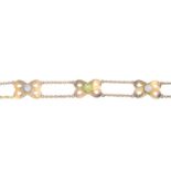 An early 20th century 9ct gold peridot and split pearl bracelet.With one mother-of-pearl