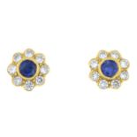 A pair of 18ct gold sapphire and diamond stud earrings.Estimated total diamond weight 0.25ct.