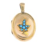 An early 20th century gold memorial locket, with turquoise foliate highlight.Length 3.7cms.