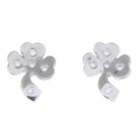 A pair of 18ct gold brilliant-cut diamond clover earrings.Estimated total diamond weight