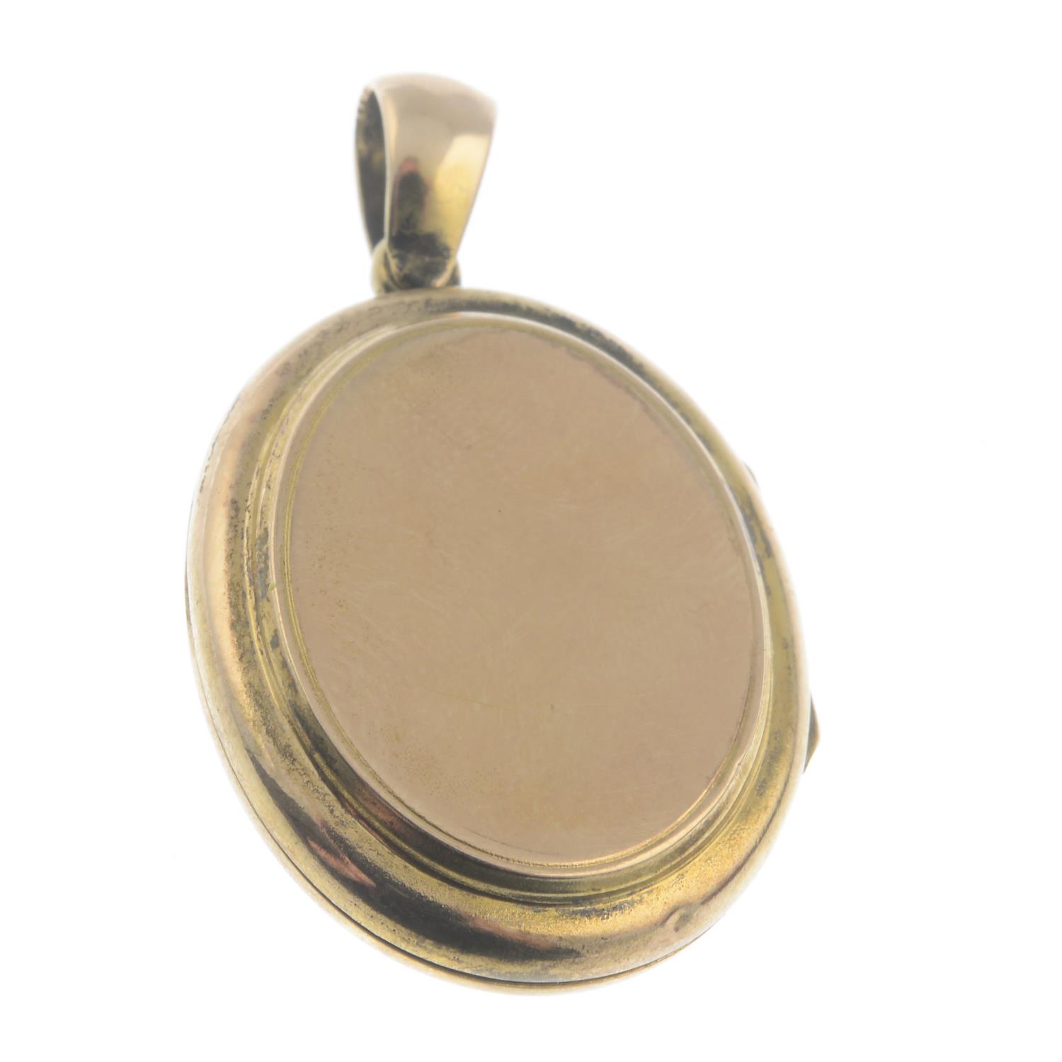 An early 20th century gold memorial locket, with turquoise foliate highlight.Length 3.7cms. - Image 2 of 2