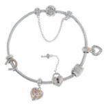 A silver charm bracelet, with five charms, by Clogau.Maker's marks for Clogau.