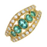 An emerald and diamond dress ring.Estimated total diamond weight 0.20ct.