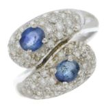 A sapphire and diamond dress ring.Estimated total diamond weight 0.40ct.