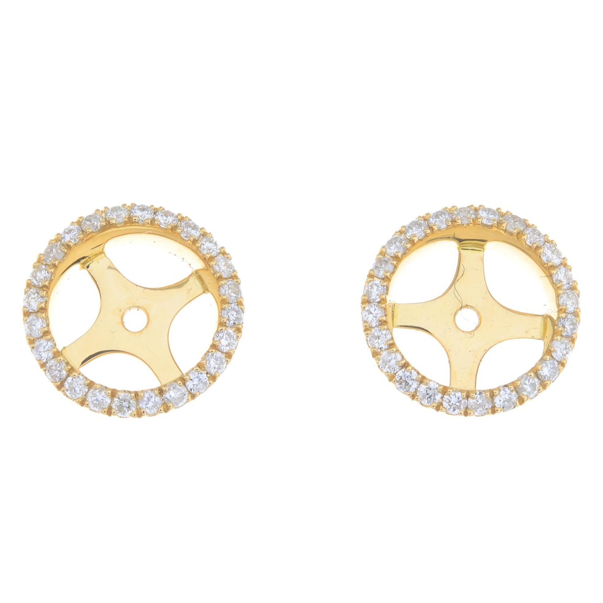 A pair of 18ct gold diamond stud earring jackets.Estimated total diamond weight 0.40ct.