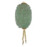 A carved green hardstone pendant.Length 7.2cms.