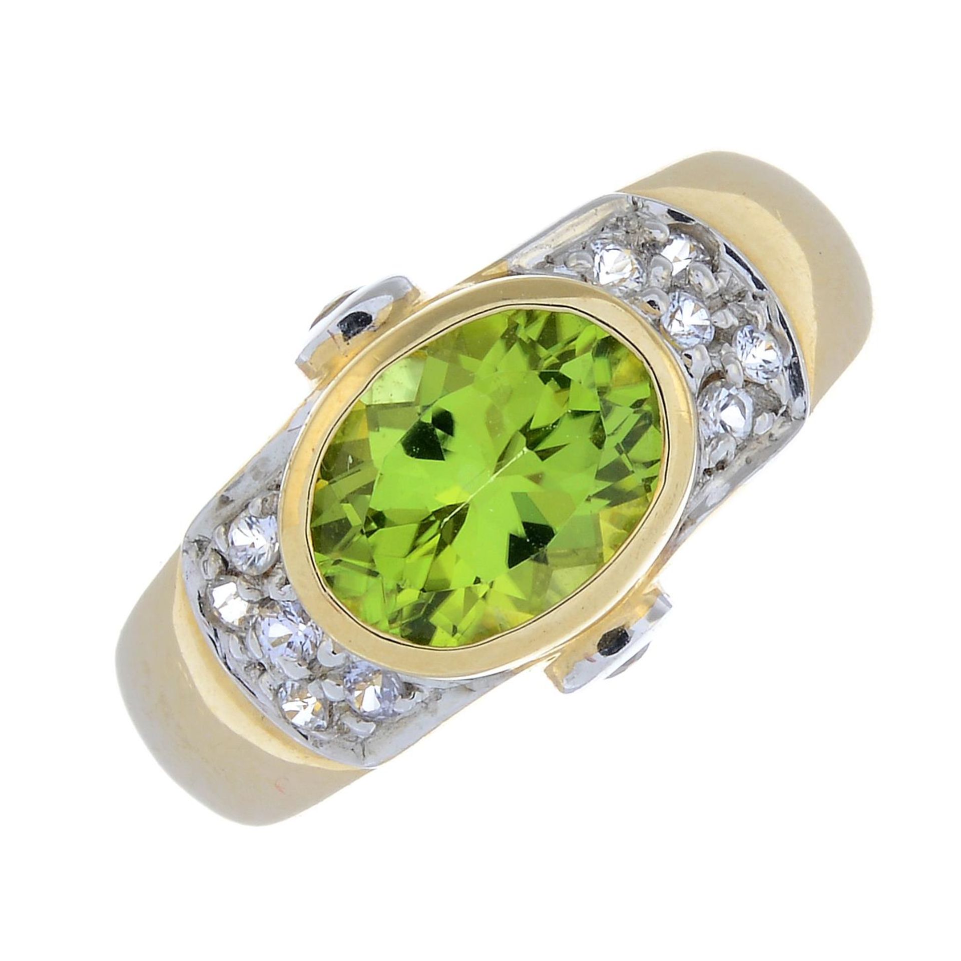 A 9ct gold peridot and cubic zirconia dress ring.Hallmarks for 9ct gold.
