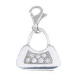 A diamond handbag charm.Estimated total diamond weight 0.10ct.