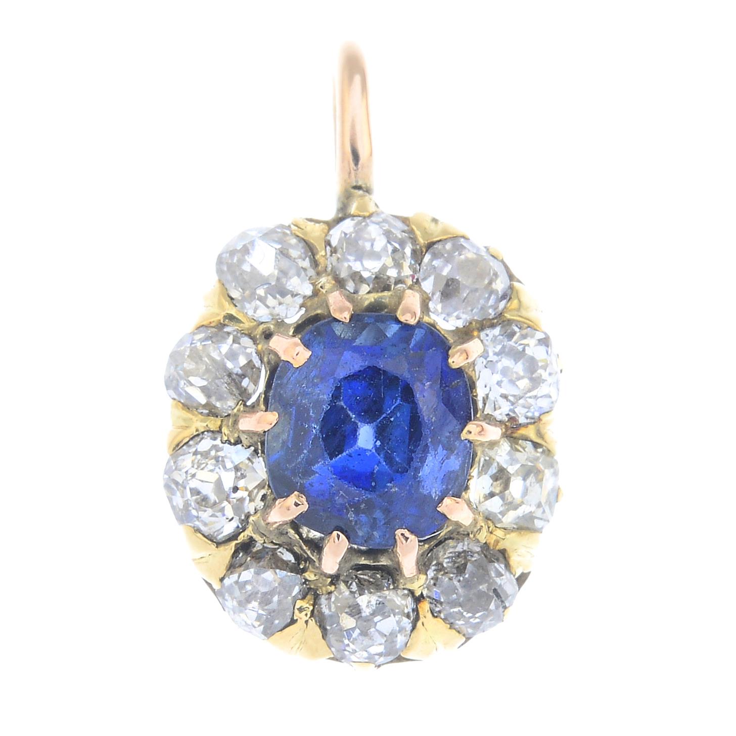 An early 20th century gold sapphire and old-cut diamond cluster pendant.