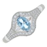 An 18ct gold aquamarine and brilliant-cut diamond dress ring.Estimated total diamond weight