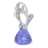 A tanzanite and diamond pendant.Stamped 18K.