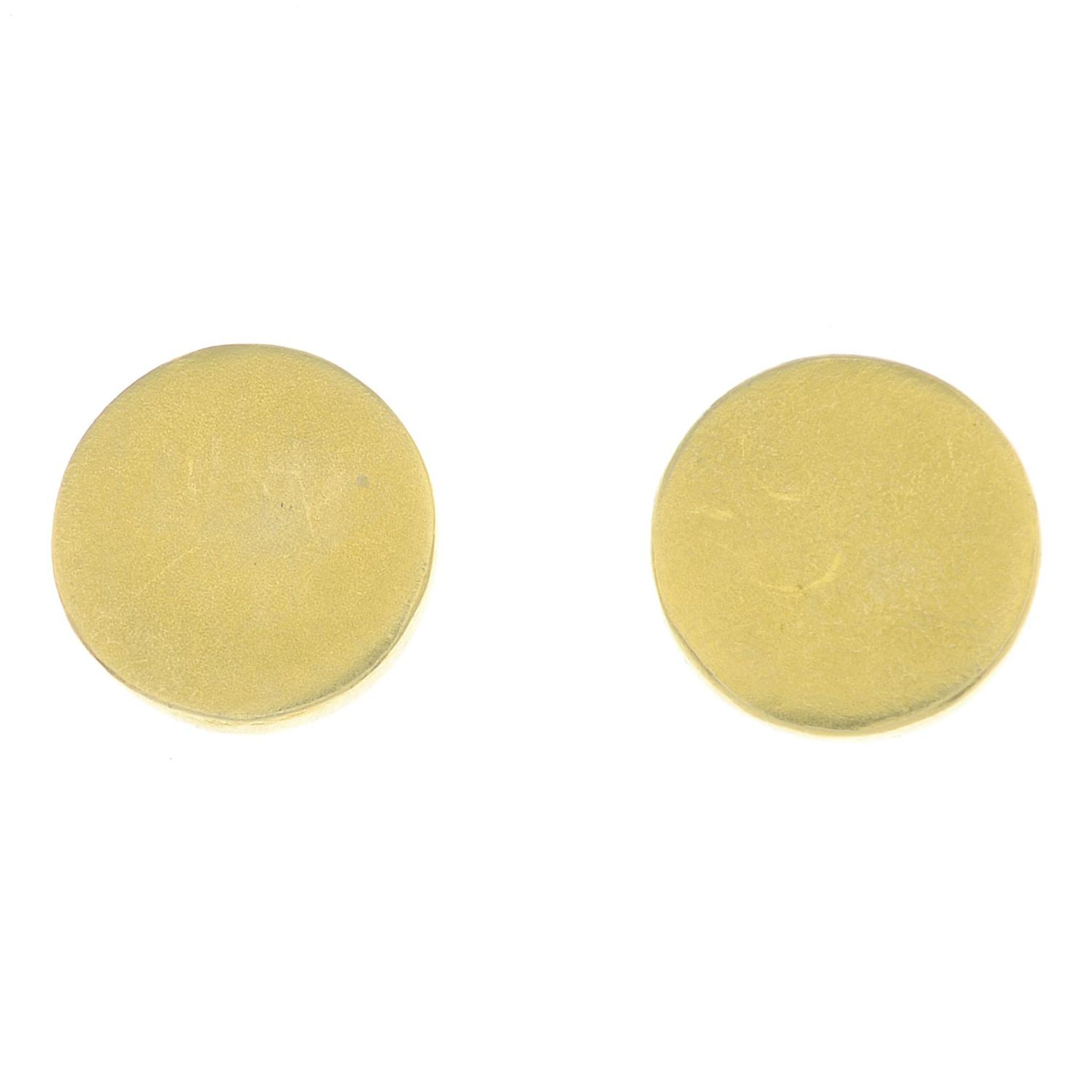A pair of circular stud earrings.Stamped 18K 750.