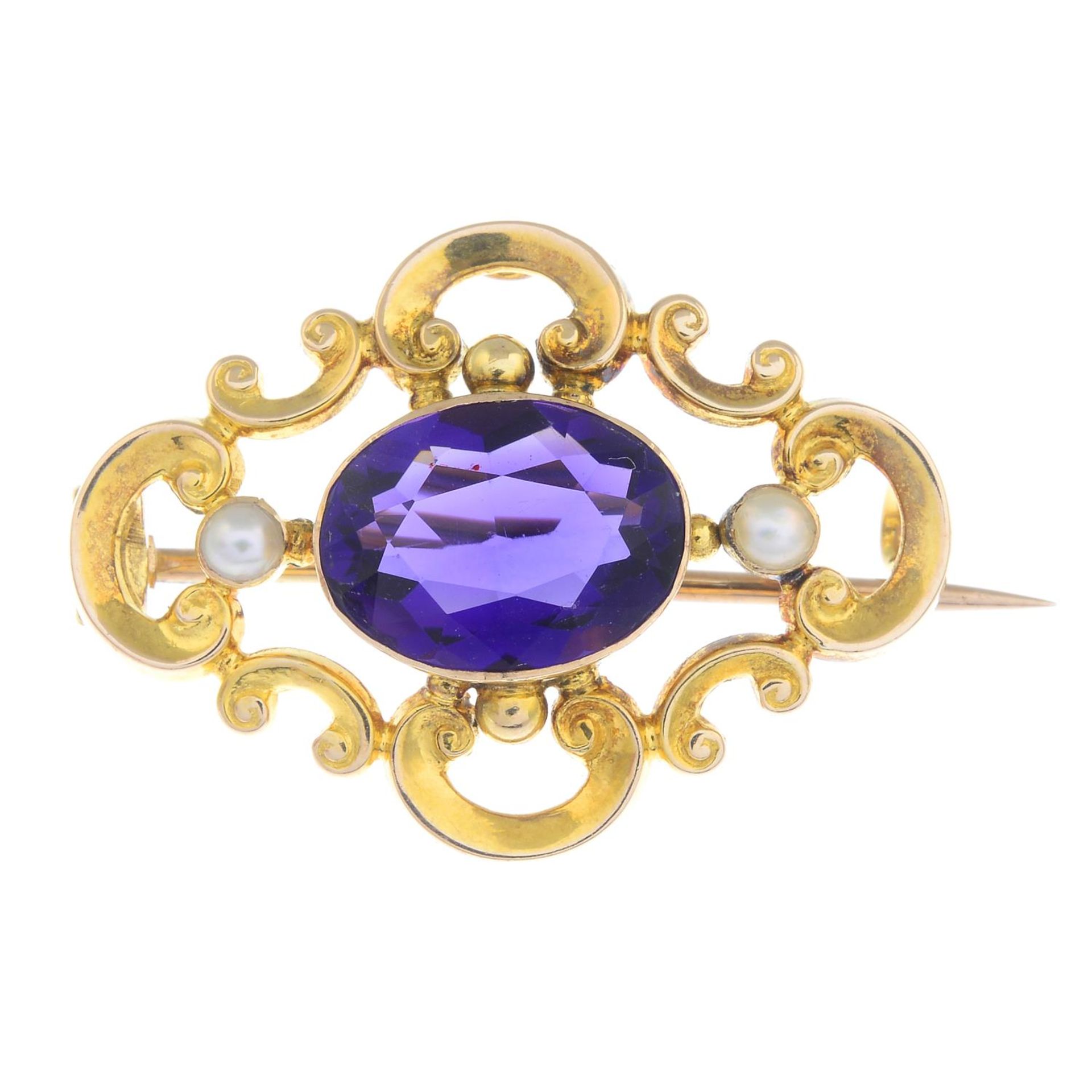 An early 20th century 15ct gold amethyst and split pearl openwork brooch.Stamped 15CT.