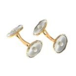 A pair of mother-of-pear and seed pearl cufflinks.