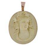 A lava cameo pendant, carved to depict Dionysus.