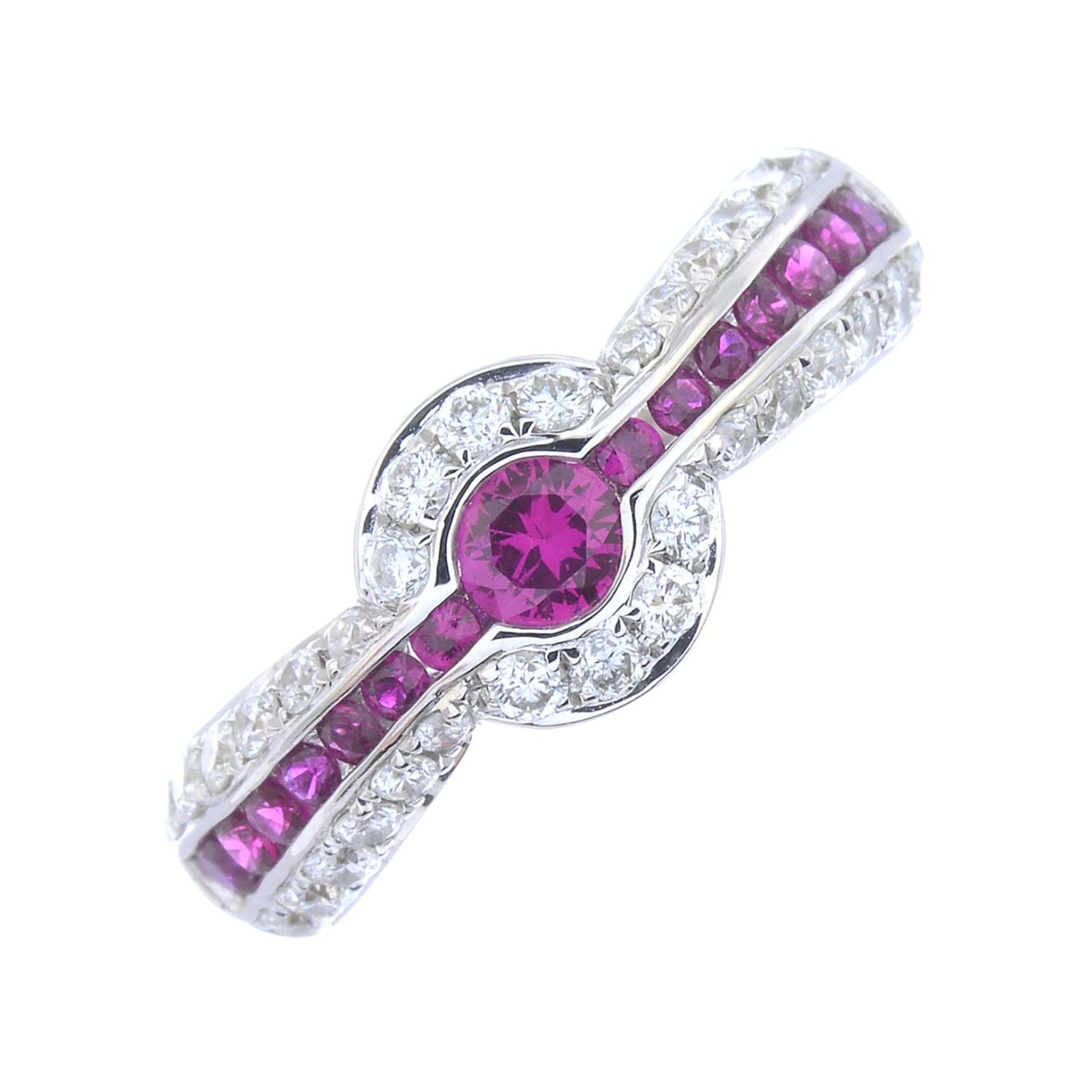 A diamond and ruby dress ring.Total ruby weight 0.48ct, total diamond weight 0.44ct.