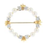 A 9ct gold diamond and cultured pearl brooch.Estimated total diamond weight 0.80ct.