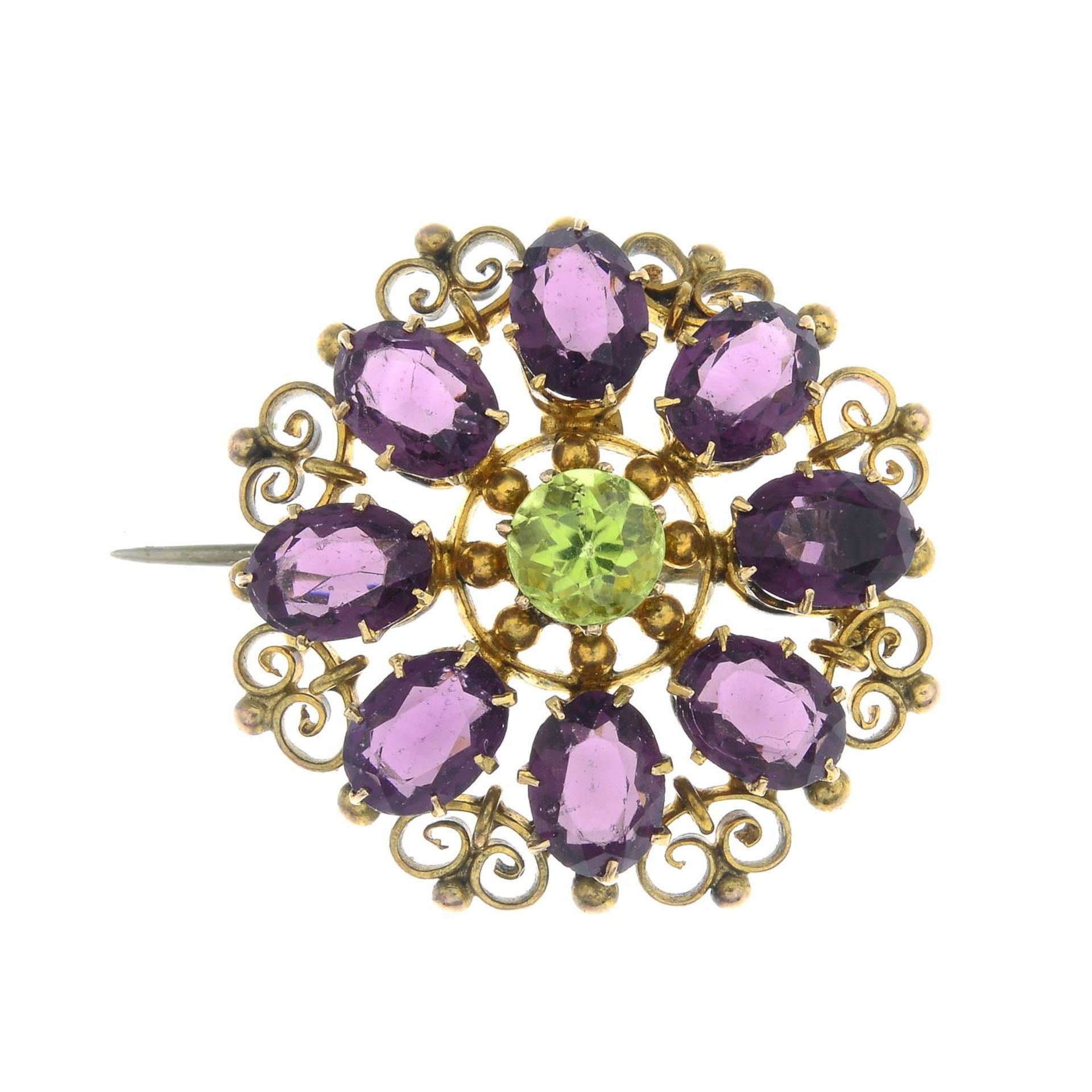 An amethyst and peridot brooch.Stamped 9CT.