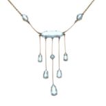 A late 19th century 9ct gold aquamarine fringe necklace, with later integral chain replacement.