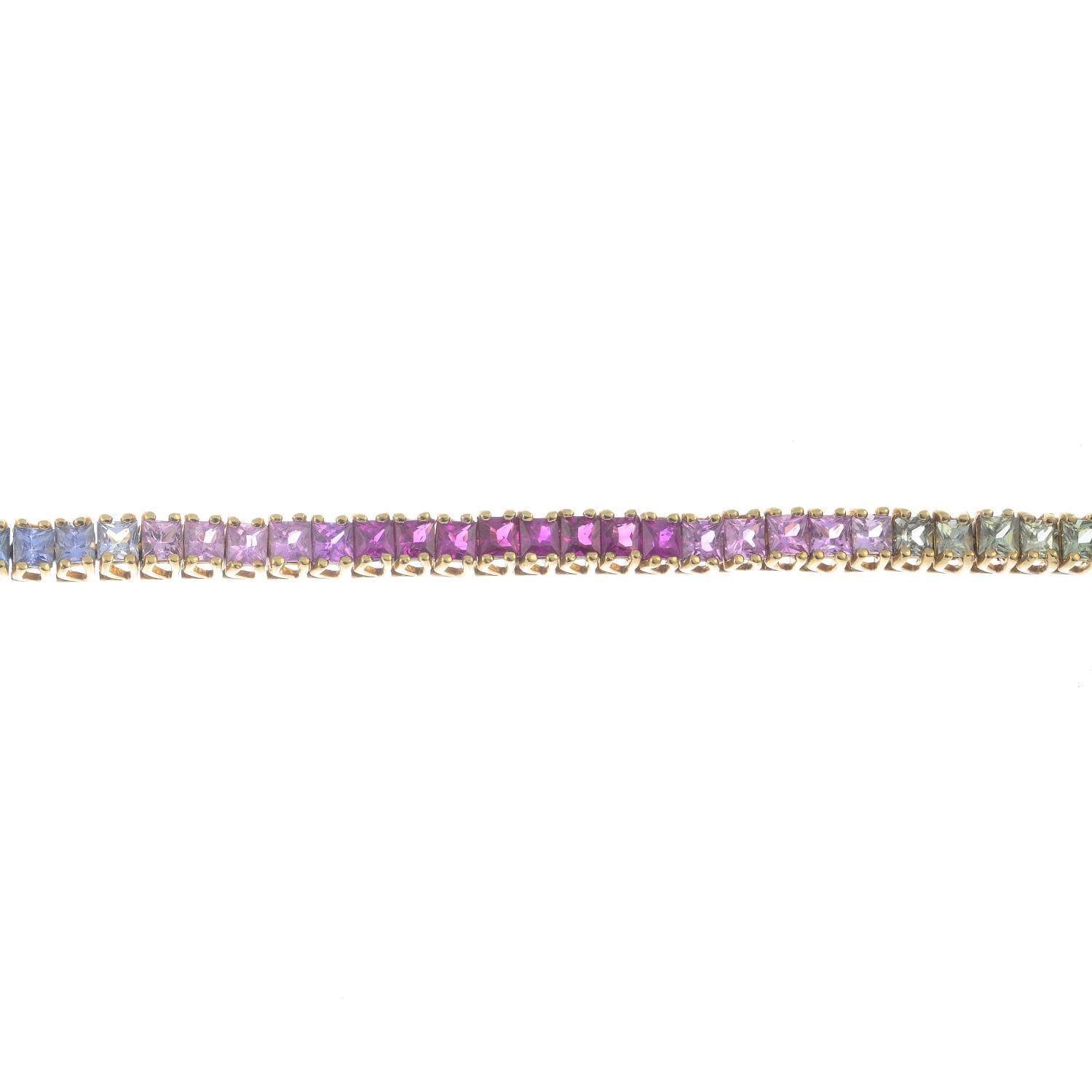 A 9ct gold vari-hue sapphire bracelet.Hallmarks for 9ct gold.