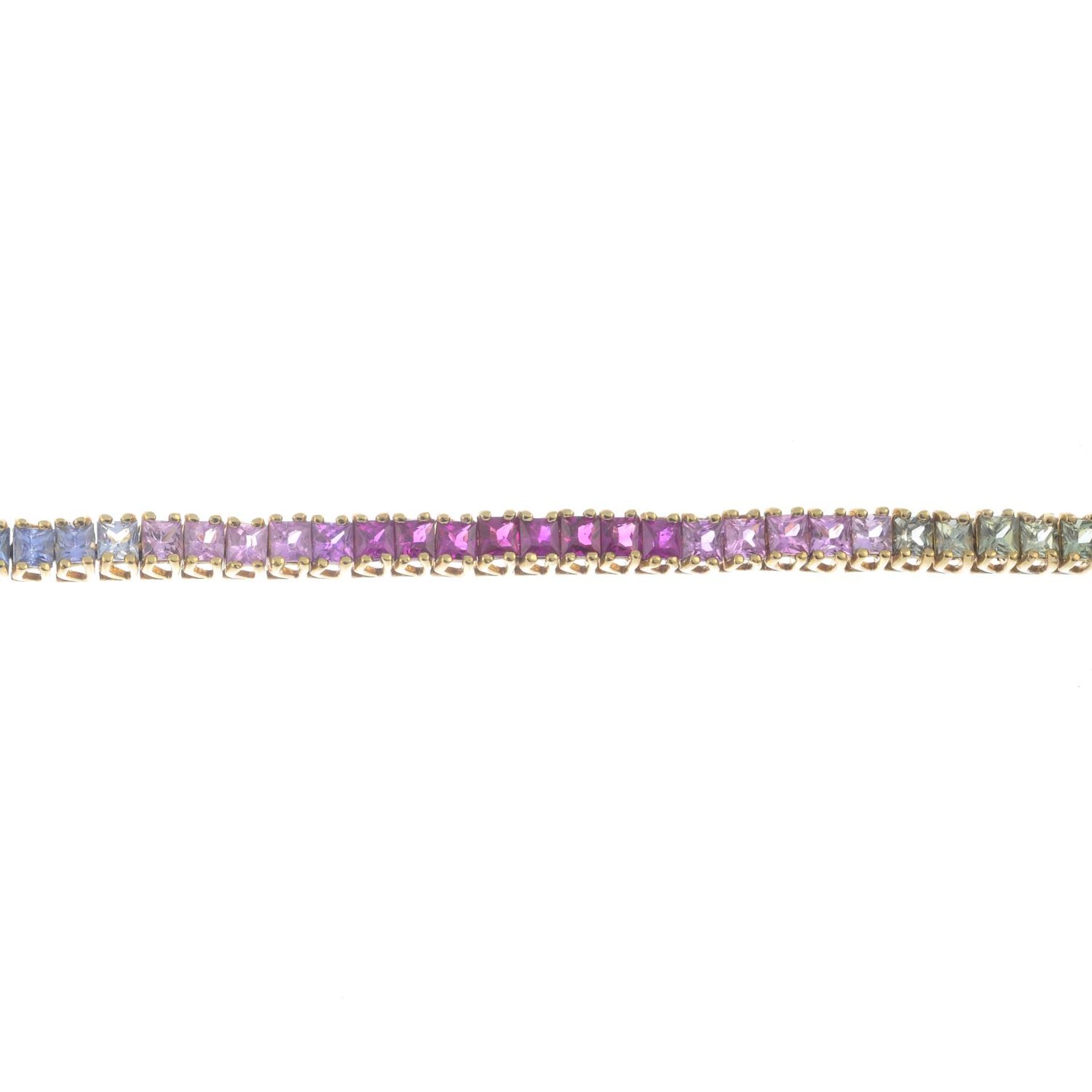 A 9ct gold vari-hue sapphire bracelet.Hallmarks for 9ct gold.